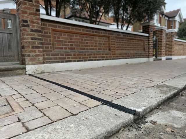 EV charging channel installed across a pavement