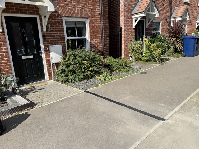 EV charging channel installed across a pavement