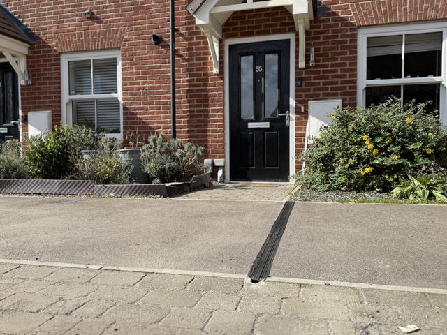 EV charging channel installed across a pavement