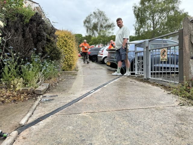 EV charging channel installed across a pavement