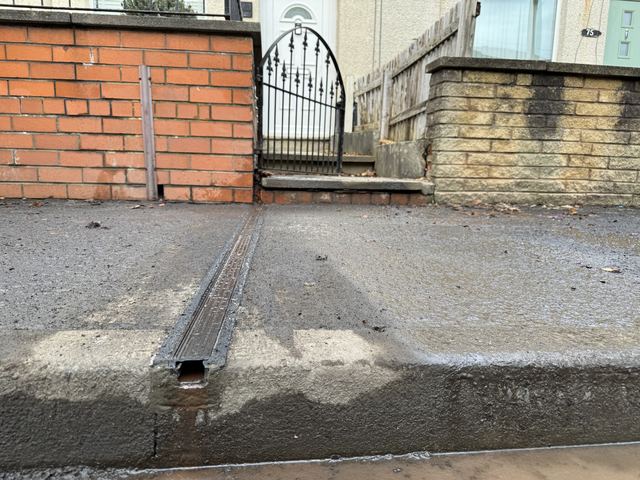 EV charging channel installed across a pavement