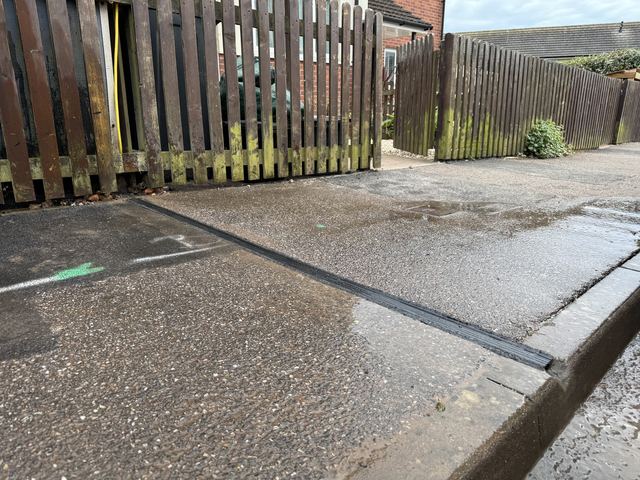 EV charging channel installed across a pavement