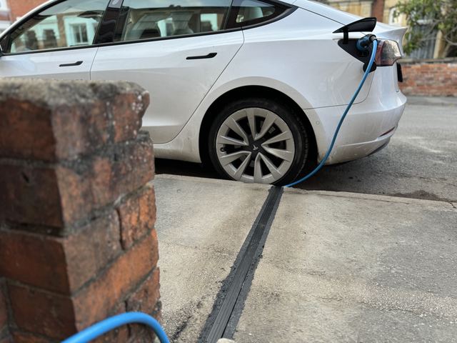 EV charging channel installed across a pavement