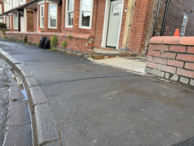 EV charging channel installed across a pavement