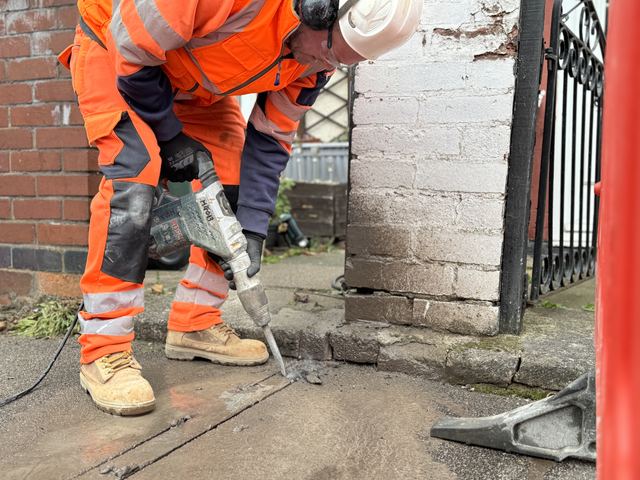 EV charging channel installed across a pavement