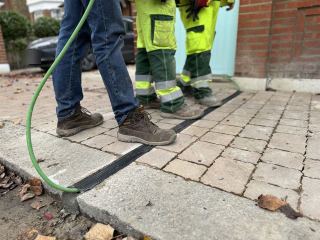 EV charging channel installed across a pavement