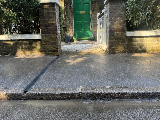 EV charging channel installed across a pavement